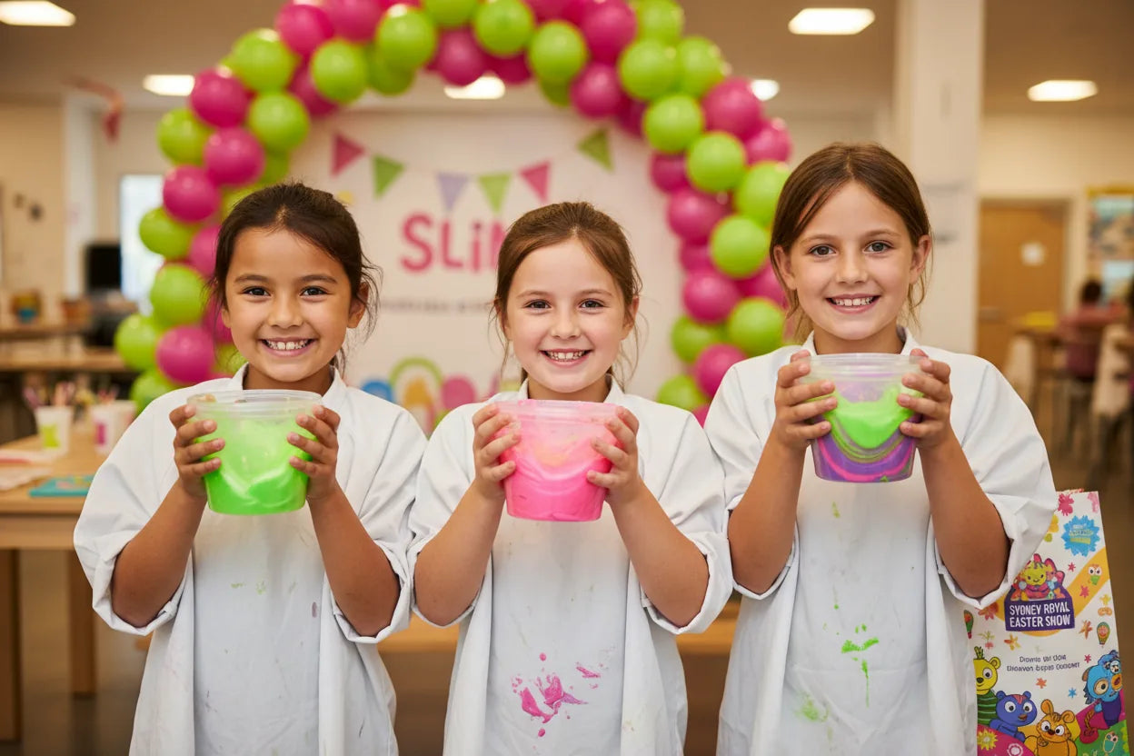 Happy kids holding their slime creations